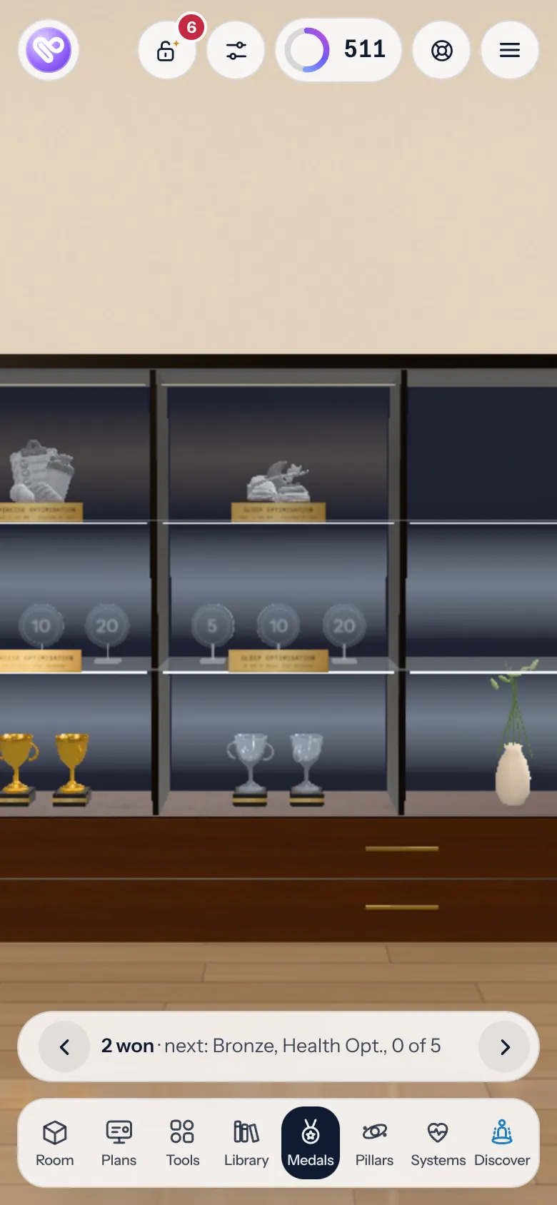 The trophy cabinet in My Lifestyle Hub, with medals for check-ins kept up
